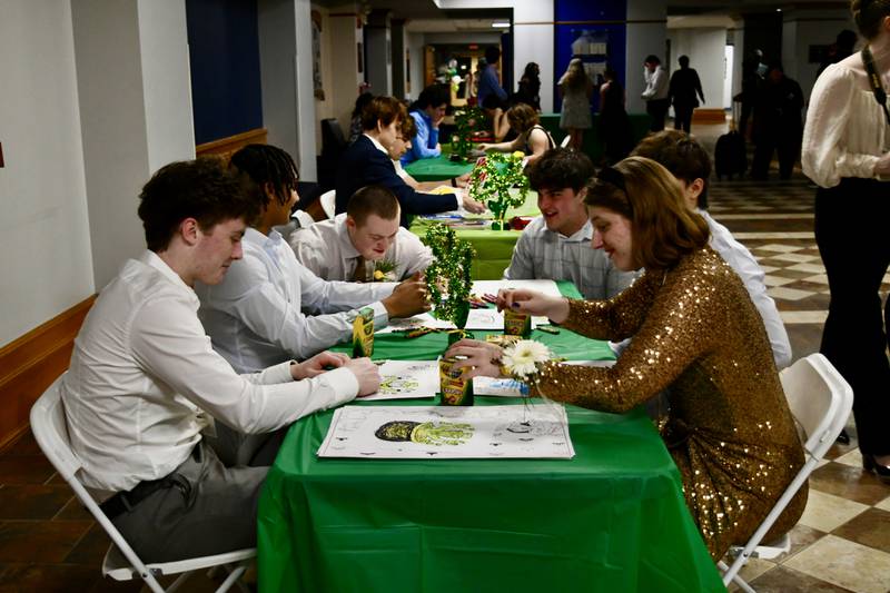 Nazareth student Landon Thome and his guest, Anna, enjoy quiet time coloring during the 7th FISH Prom for Teens with Disabilities on Saturday, March 8, 2025 at Nazareth Academy in La Grange Park.