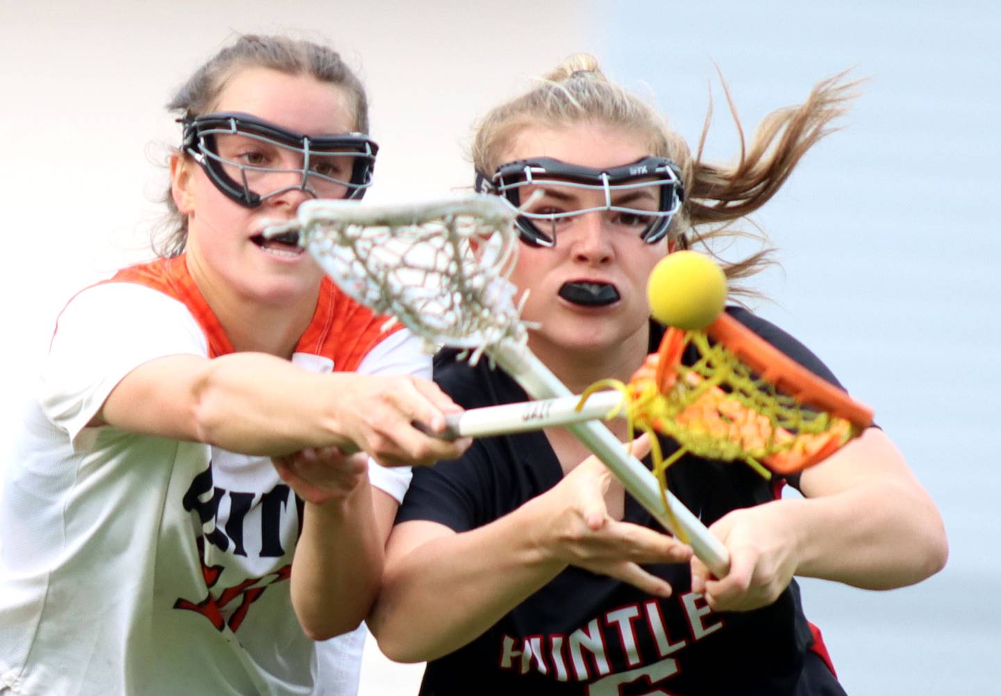 Crystal Lake Central United’s Emma Sieg, left, races Huntley’s Leah Holmberg for the ball in IHSA Sectional Title Game action at Crystal Lake Central High School in Crystal Lake on Friday, May 30, 2025.