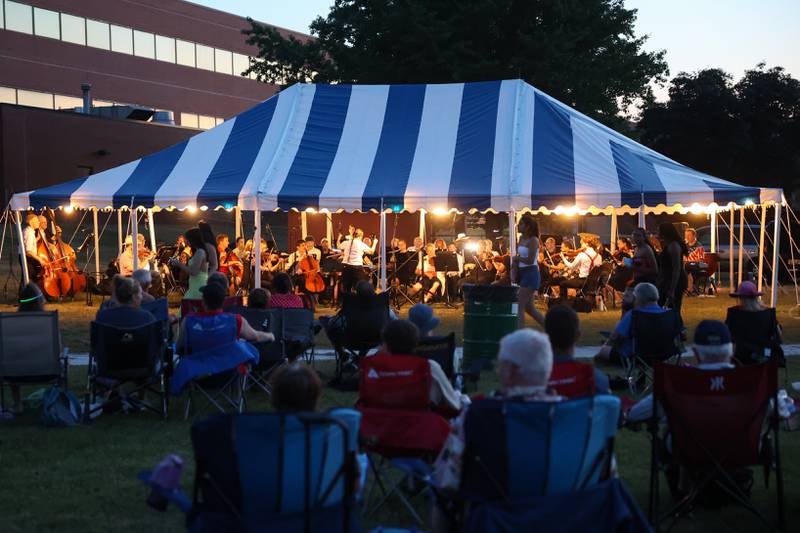 The Kankakee Valley Symphony Orchestra performs ahead of the city of Kankakee's fireworks show at Kankakee Community College on Friday, July 4, 2025.