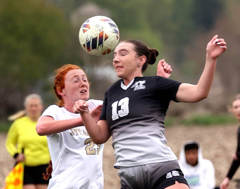 Sycamore's Isabelle Segreti (left) and Kaneland's Kyra Lilly go up for a header Wednesday, April 30, 2025, during their game at Kaneland High School in Maple Park.