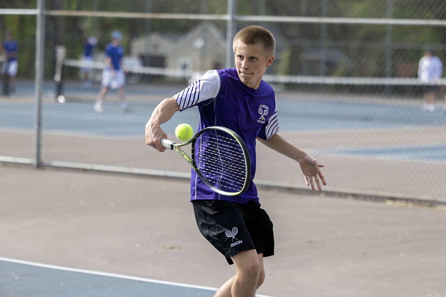 Dixon’s Derek Miller returns a shot against Newman while playing doubles Tuesday, May 9, 2023.
