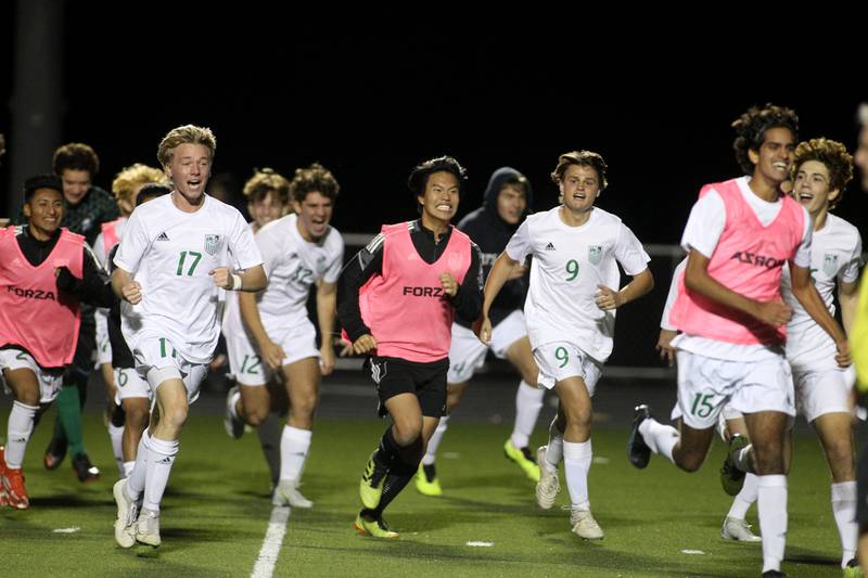 York players celebrate their 3A Boys Soccer Supersectional win over Elgin at Streamwood High School on Tuesday, Nov. 1, 2022.