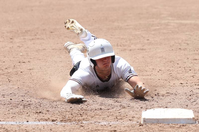 Joliet Catholic’s Trey Swiderski slides into third on a RBI triple against Spring Valley Hall in the Class 2A Geneseo Supersectional on Monday, May 29, 2023 in Geneseo.