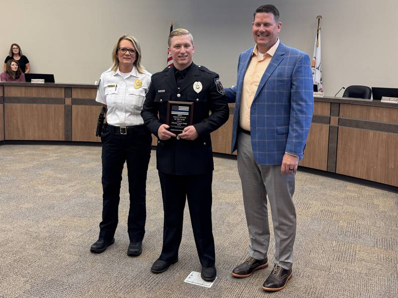 Morris Police Chief Alicia Steffes with 2024 Officer of the Year Trevor Hodge and Morris Mayor Chris Brown.