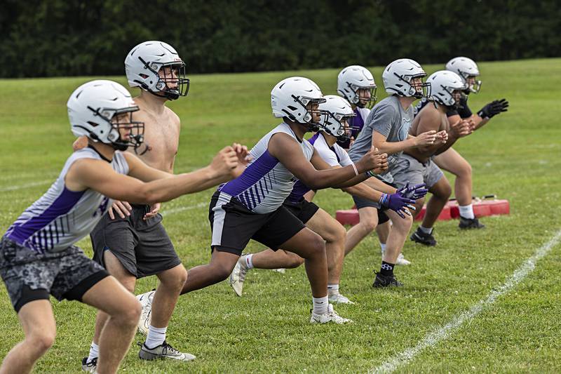 Linemen run through drills Monday, Aug. 12, 2024, during the first day of football practice for Dixon High School.
