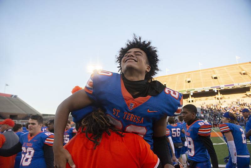 St. Teresa’s Billy Guyse is lifted after his team wins the title against Tri-Valley in the class 2A IHSA football state championship game Friday, Nov. 25, 2022.