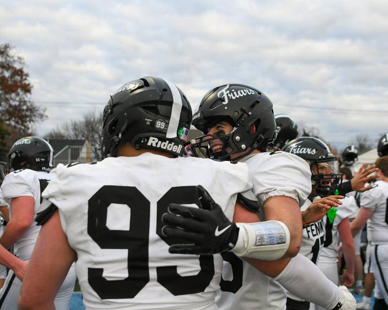 Fenwick's Rocco Nero (25) is all smiles as he celebrates with teammate Luke Leone (99) after beating Nazareth Academy on Saturday Nov. 22, 2025, during the 6A semifinals overtime game held at Nazareth Academy High School in La Grange Park.