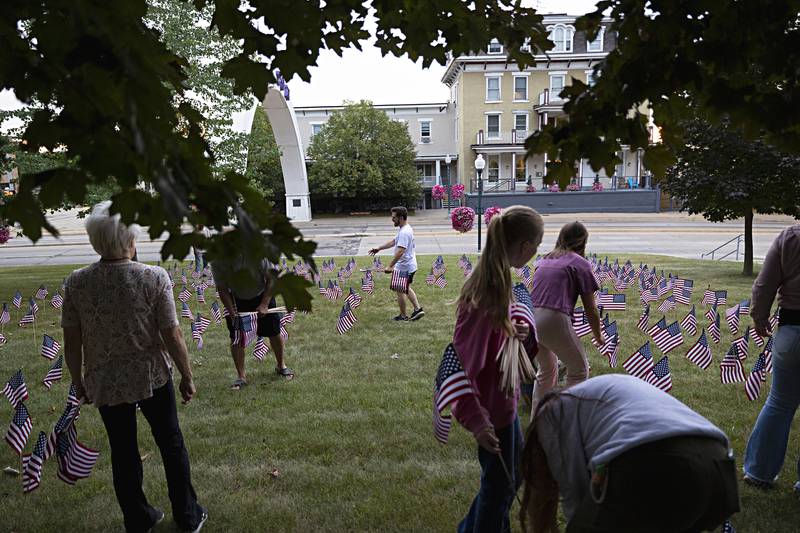 YAF Boyhood Home director Kyle Ferrebee directs the group as they plant the flags on the courthouse lawn Wednesday, Sept. 6, 2023. The Young America’s Foundation will be hosting a 9/11 memorial service Saturday, Sept. 9, 2023 at Sauk Valley College at 10am.