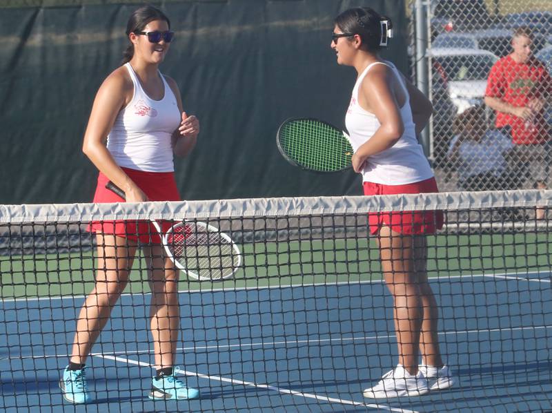 Ottawa number one tennis players Zulee Moreland and Yaquelin Hernandez-Solis converse while playing tennis on Tuesday, Sept. 16, 2025 at Ottawa High School.