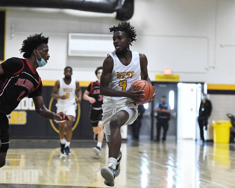 Joliet West's Toby Onyekonwu (4) drives to the basket on Saturday, Jan. 22, 2022, at Joliet