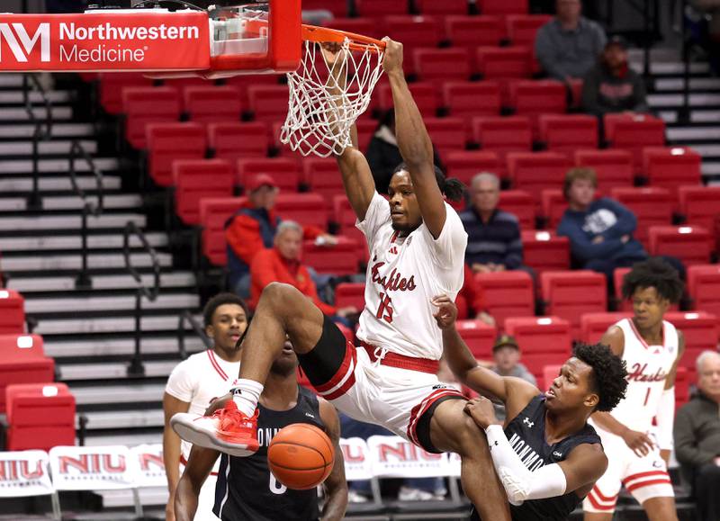 Northern Illinois' Ethan Butler gets a put-back dunk in front of Monmouth's Madison Durr during their game Tuesday, Nov. 12, 2024, in the Convocation Center at NIU in DeKalb.