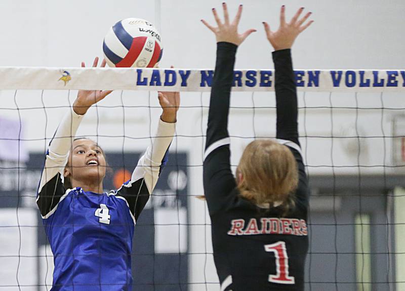Newark's Kiara Wesseh (4) pushes the ball past Earlville's Chesney Auter (1) on Tuesday, Sept. 13, 2022, in Newark.