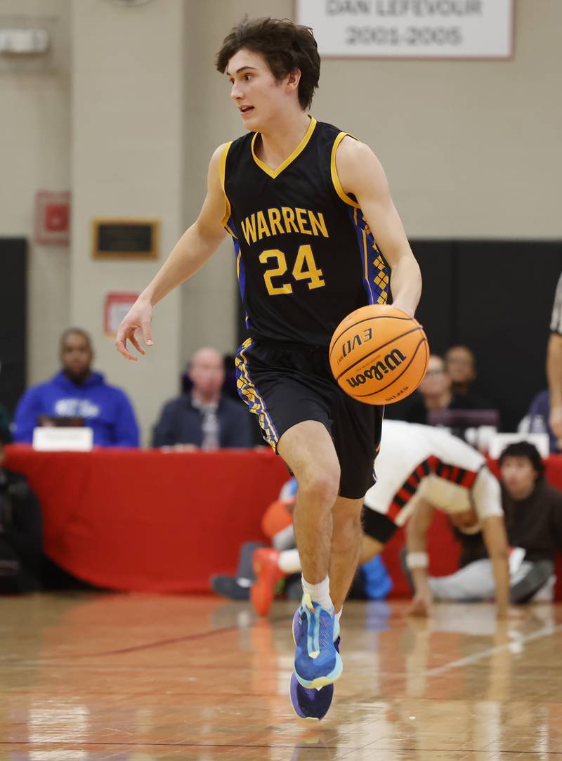 Warren's Joel Paasch (24) handles the ball during the When Sides Collide Shootout basketball tournament between Benet Academy and Warren Township high schools on Saturday, Jan. 24, 2026 in Lisle, IL.