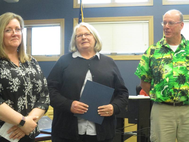 Dixie DeBord, center, of the Yorkville Public Library is retiring after more than 23 years of service. She was honored by Library Director Shelley Augustine, left, and Mayor John Purcell on April 25, 2023 at the Yorkville City Council meeting.
