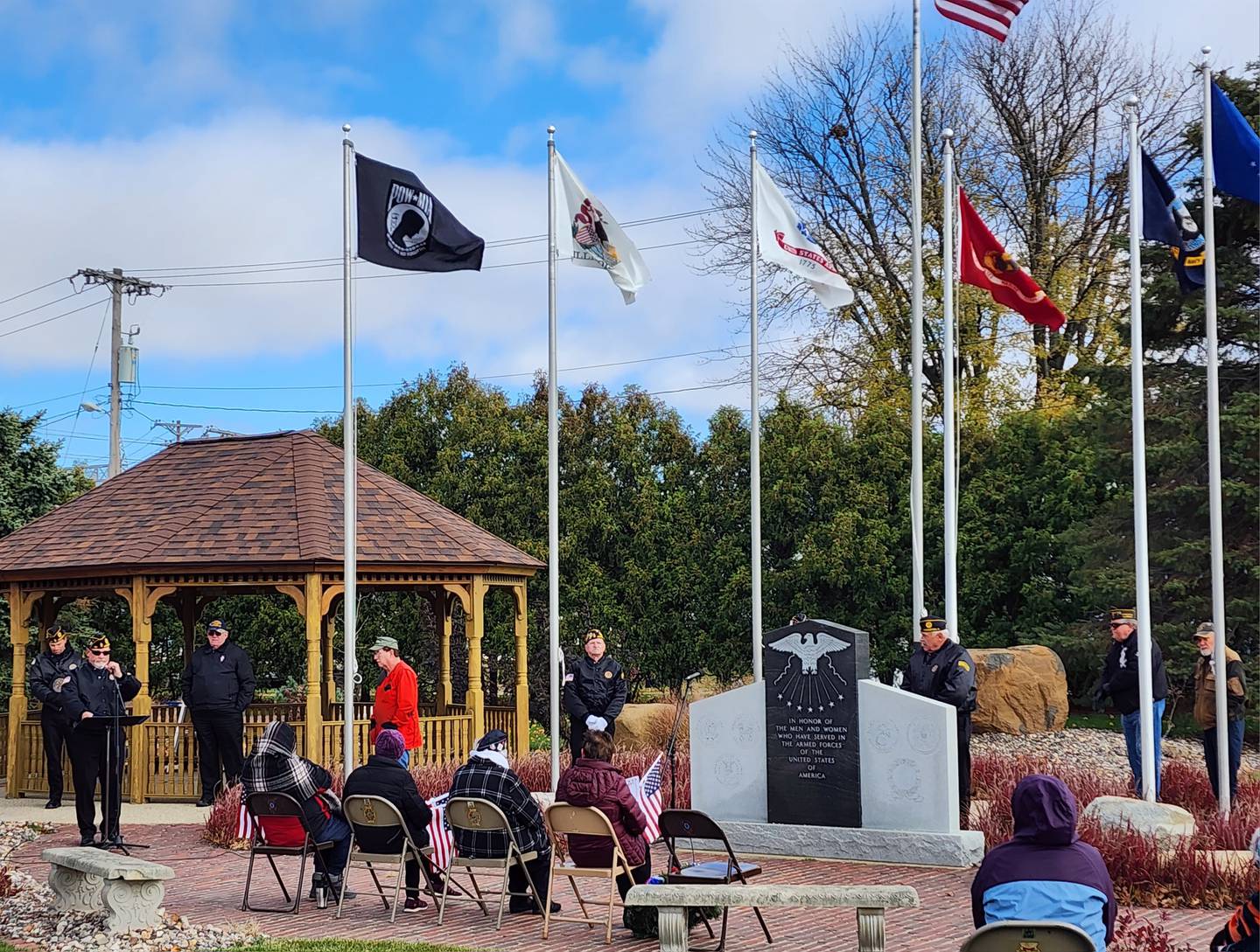 The event began with an invocation, followed by a ceremonial raising of the flags at the newly designed Veterans Park in Princeton, across from City Hall.