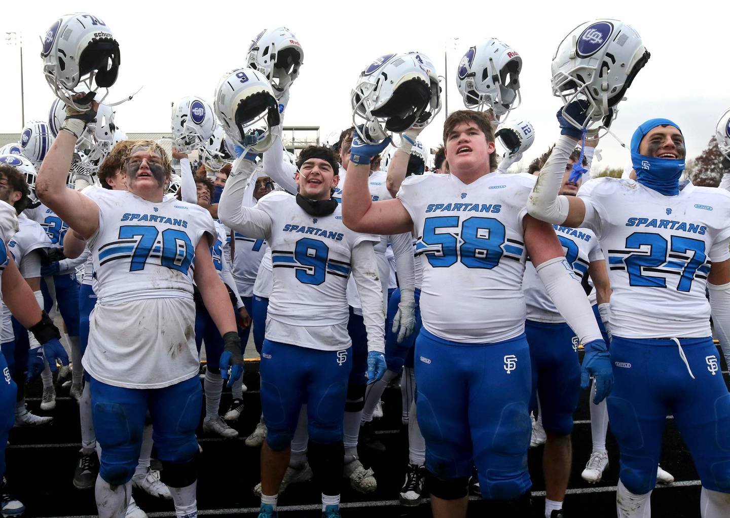 St. Francis players celebrate Saturday, Nov. 16, 2024, after their Class 5A quarterfinal win over Sycamore at Sycamore High School.