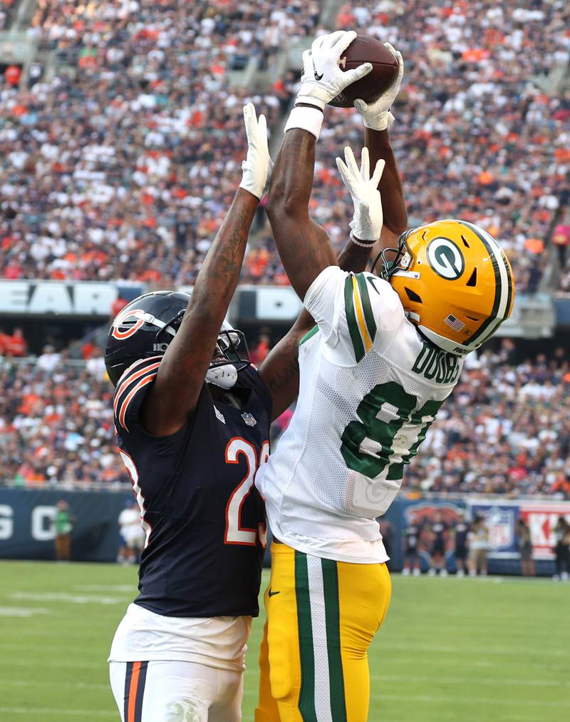 Green Bay Packers wide receiver Romeo Doubs catches a touchdown pass over Chicago Bears cornerback Tyrique Stevenson during their game Sunday, Sept. 10, 2023, at Soldier Field in Chicago.