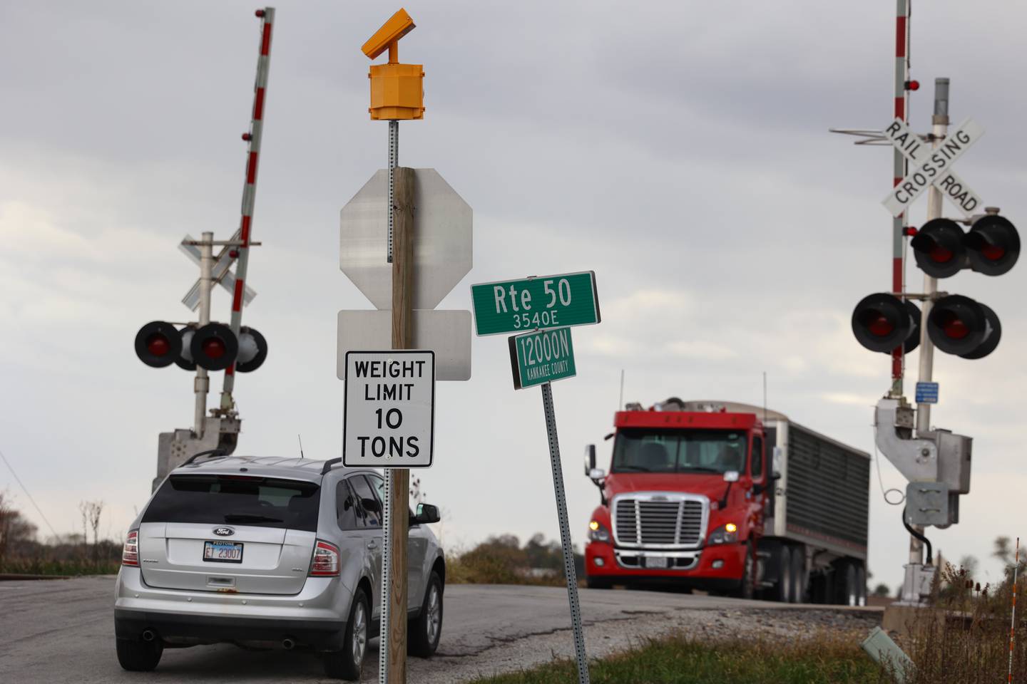Vehicles cross the railroad tracks on County Line Road west of IL Route 50 on Tuesday, Oct. 21, 2025. There have been 18 accidents and four fatalities this year at the intersection.