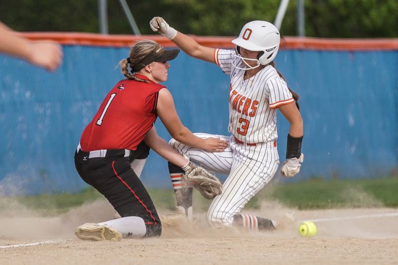 Oswego’s Madelyne Lohrman (3) beats the throw to third during a softball game against Yorkville at Oswego High School on Thursday, May 15, 2025.
