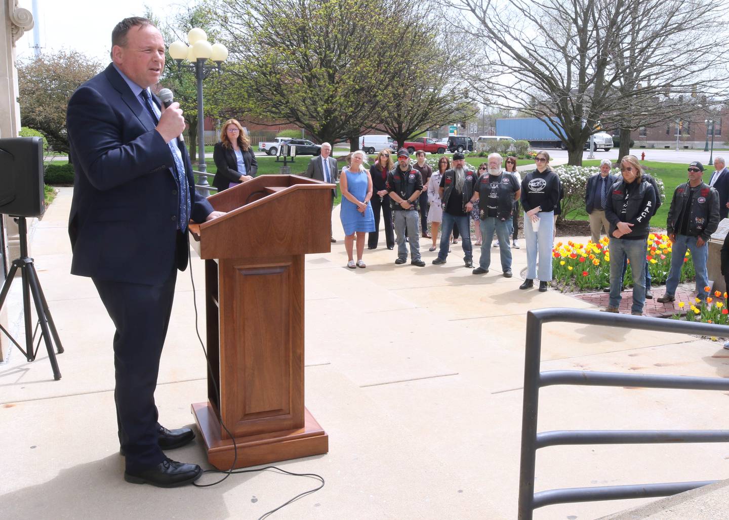 DeKalb County State’s Attorney Rick Amato speaks about the problems of domestic violence and child abuse Tuesday, April 16, 2024, during the Hands Around the Courthouse event at the DeKalb County Courthouse in Sycamore. The event, hosted by CASA DeKalb County and Family Service Agency of DeKalb County, was held in honor of National Child Abuse Prevention Month.