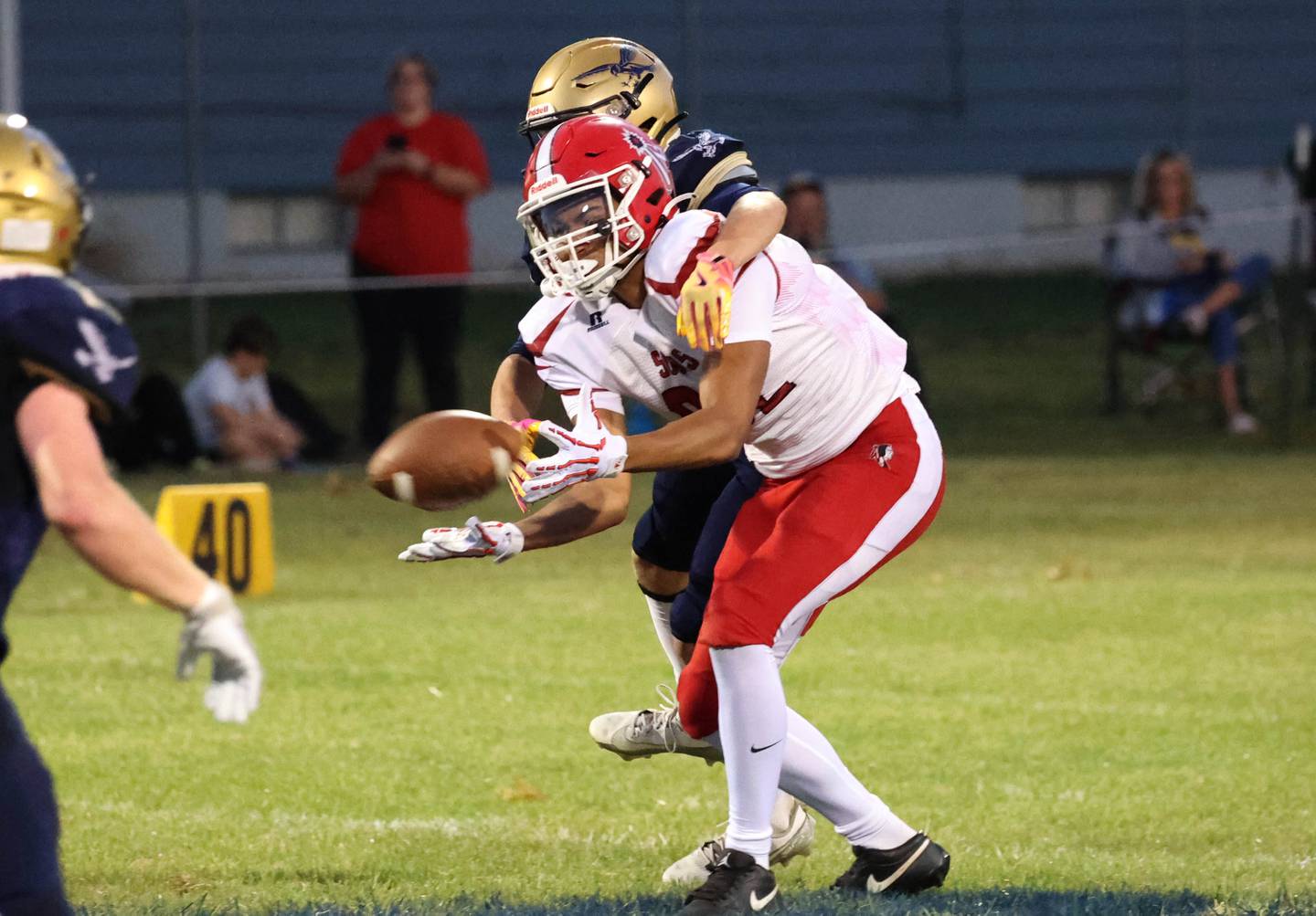 Hiawatha's Tim Pruitt breaks up the pass intended for South Beloit's Kaden Cook during their game Friday, Sept. 20, 2024, at Hiawatha High School in Kirkland.