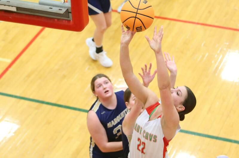 L-P's Brianna Ruppert drives to the hoop past Marquette's Madison Kozlowski on Saturday, Jan. 4, 2025 in Sellett Gymnasium at L-P High School.