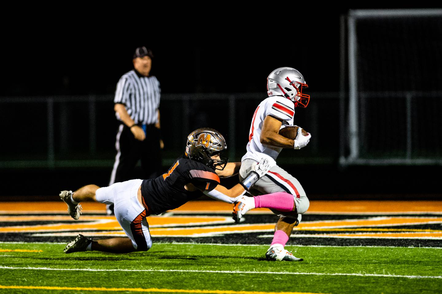Minookas Connor Christensen tries to take down Palatines Dominick Ballduring the 2nd round IHSA Class 8A playoff game against Friday Nov. 4, 2022 at Minooka High School