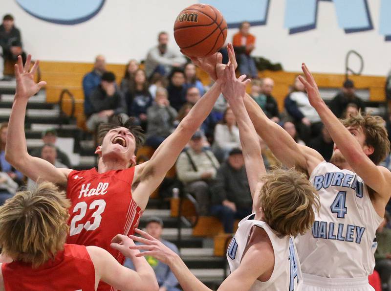 Hall's Braden Curran and Bureau Valley's Landon Hulsing jump for a rebound on Friday, Jan. 19, 2024 at Bureau Valley High School.
