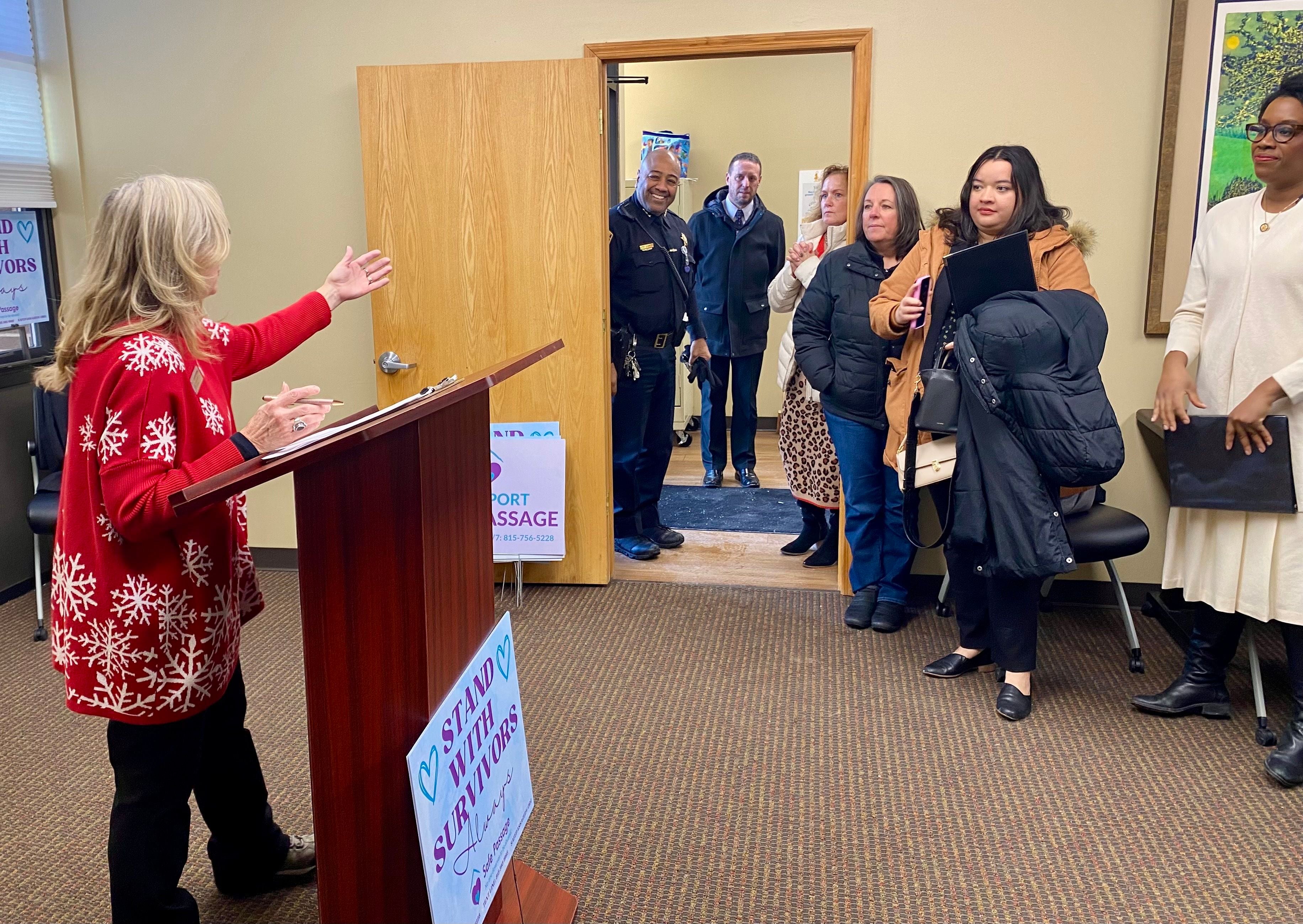 Christine Kalina (left), development director of Safe Passage Inc., speaks on Friday, Dec. 5, 2025, at a groundbreaking ceremony for the agency's new crisis shelter, expected to begin construction in the spring.