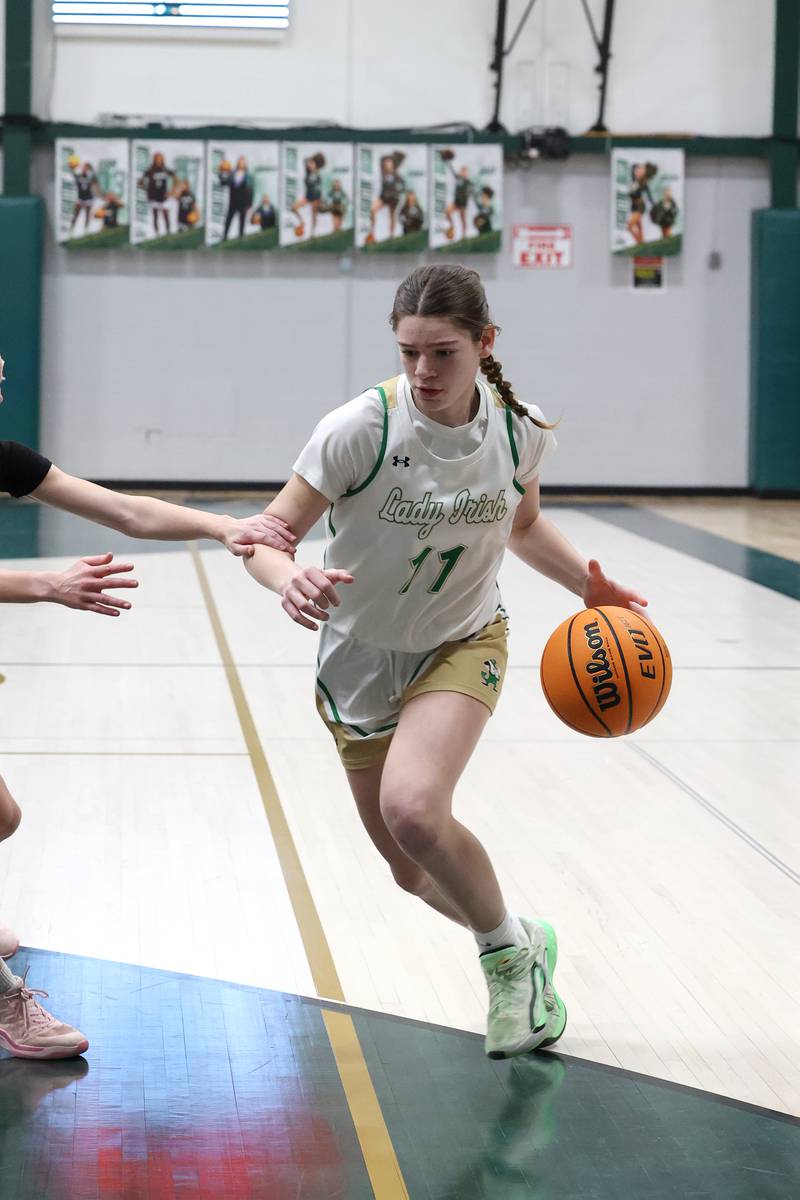 Bishop McNamara's Dylan Pallisard drives to the lane during the Fightin' Irish's 67-27 victory over Chicago Christian on Monday, Jan. 26, 2026.