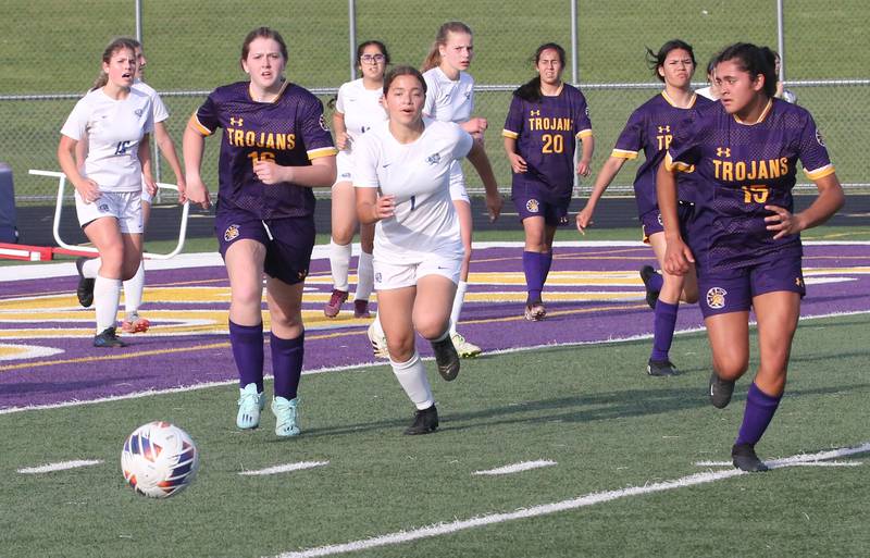 Princeton and Mendota players run toward the ball during the Class 1A Regional semifinal game on Tuesday, May 9, 2023 at Mendota High School.