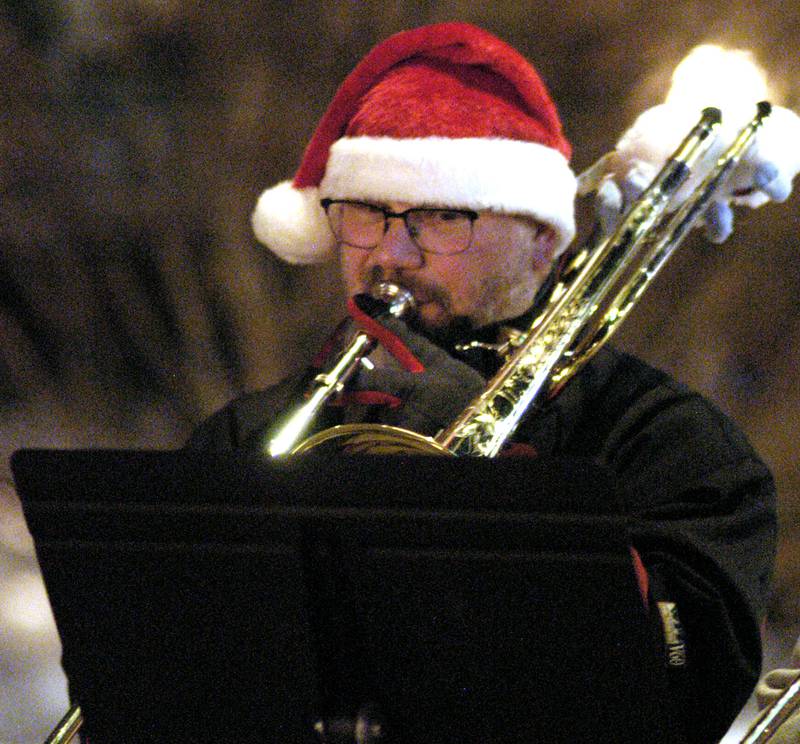 Band member Paul Ausman plays trombone during Sterling's Sights and Sounds kickoff to the holiday season. The event in downtown Sterling was held on Friday, December 5, 2025.