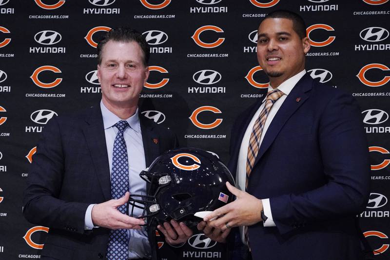 New Chicago Bears head coach Matt Eberflus, left, and new general manager Ryan Poles pose for a photo during a news conference, Monday, Jan. 31, 2022, at Halas Hall in Lake Forest.