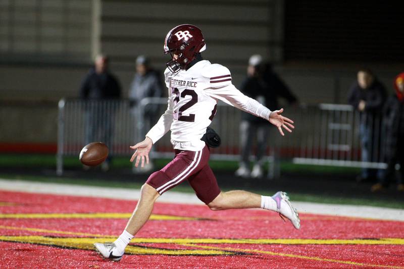 Brother Rice’s Ronan Culkin punts during a Class 7A round 1 playoff game in Batavia on Friday, Oct. 27, 2023.