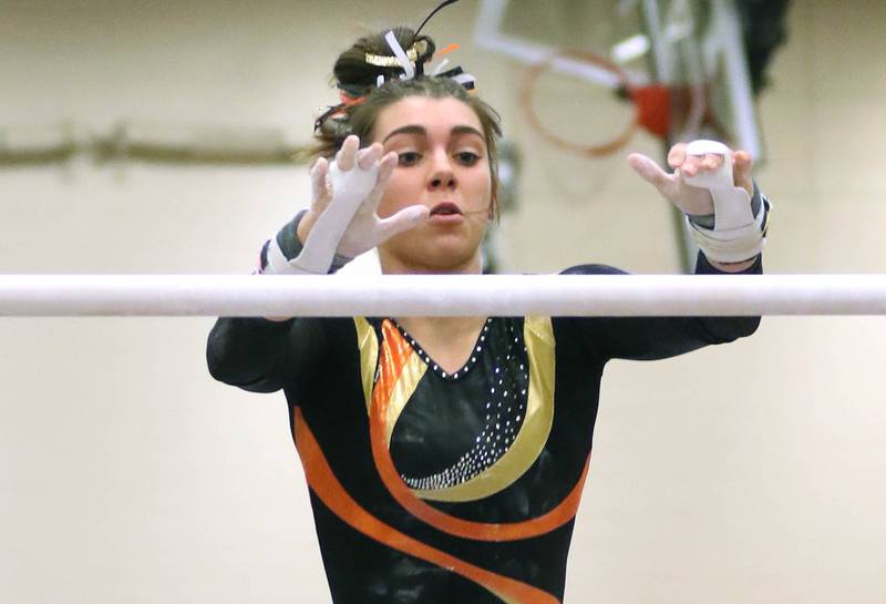 DeKalb-Sycamore gymnast Maddy Kees competes on the uneven bars during a meet Friday, Dec. 10, 2021, at DeKalb High School.