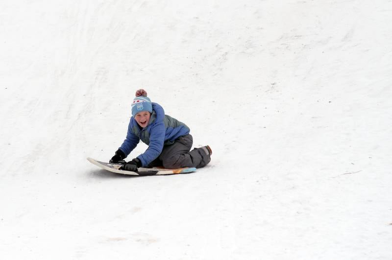 Children including Austin Doering of Wheaton enjoys a day of sledding at Northside Park in Wheaton during the winter storm Saturday, Jan 13, 2024.