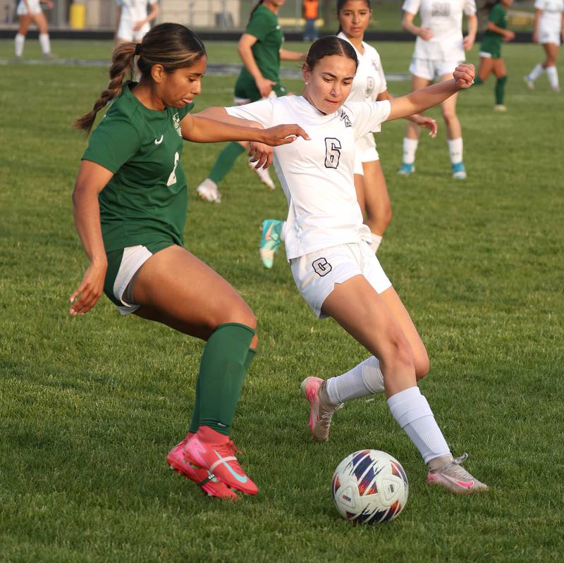 Kaneland's Taylor Mills (right) and Boylan's Betsy Millan try to win possession Wednesday, May 28, 2025, during their Class 2A sectional semifinal game at Belvidere High School.