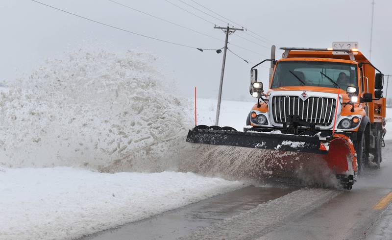 A snow plow makes its way west on Perry Road Friday, Jan. 12, 2024, near DeKalb. Several inches of snow blanketed DeKalb County Friday on top of the 6 inches that fell on the area earlier this week.