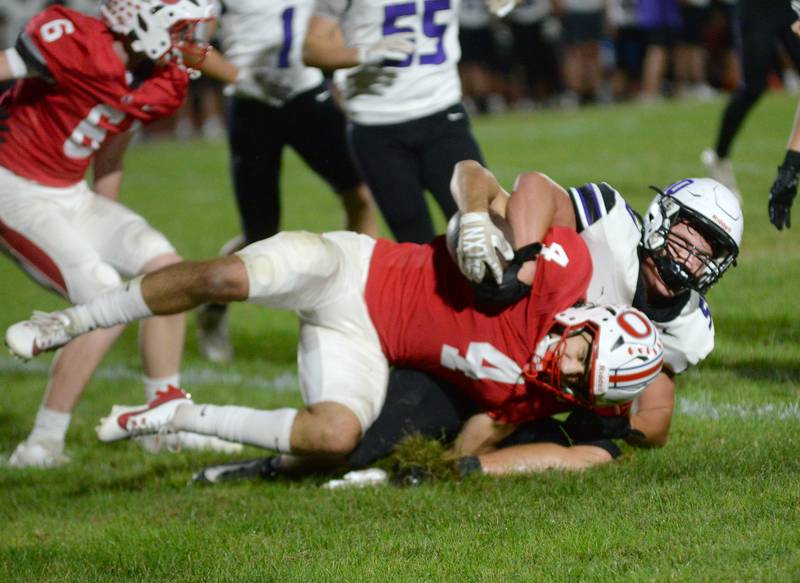 Dixon's Owen LeSage (50) tackles Oregon's Jakobi Donegan (4) on Friday, Sept. 26, 2025 at Landers-Loomis Field in Oregon.