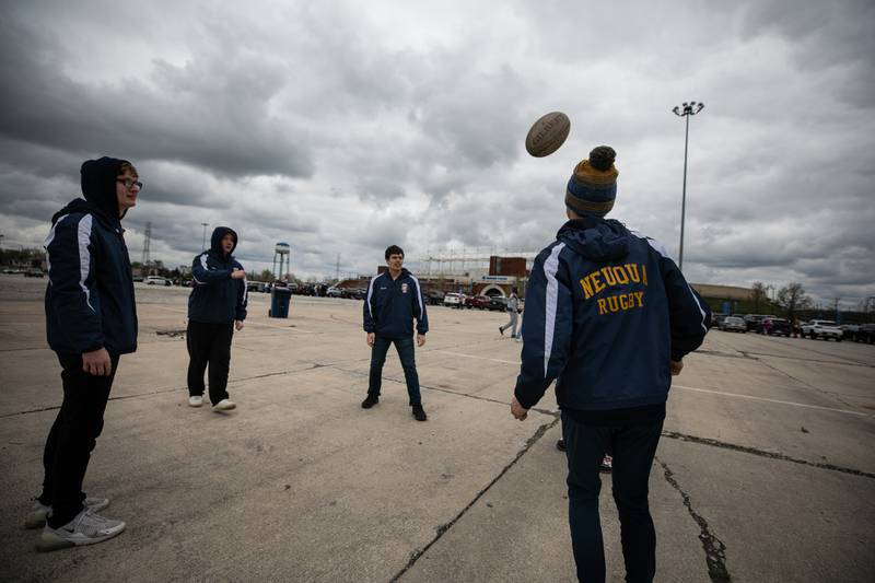 Members of the Neuqua Rugby Club, get in some rugby skill drills while tailgating outside Seat Geek Stadium before a Chicago Hounds rugby game in Bridgeview, on Sunday April 23, 2023.