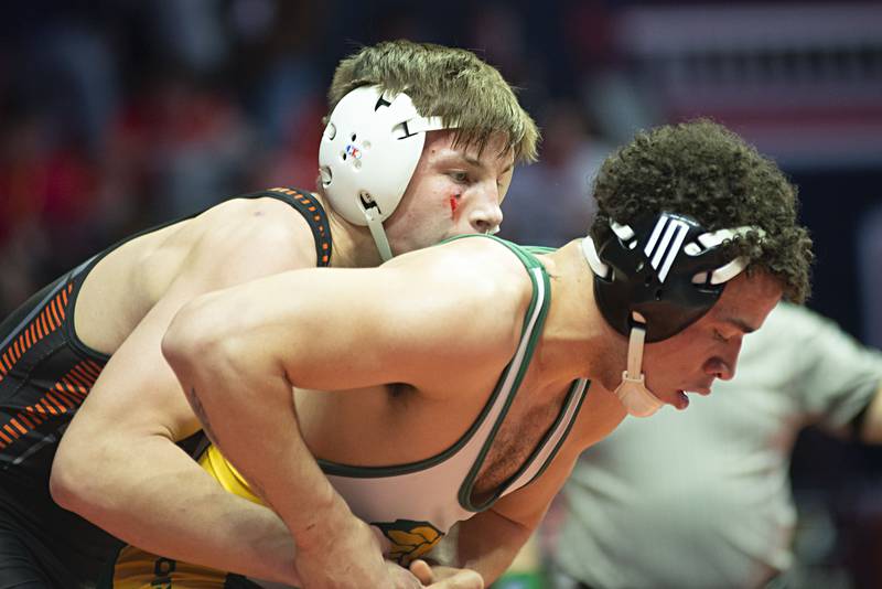 McHenry's Chris Moore, left, and Waubonsie Valley's Antonio Torres wrestle Friday during their Class 3A 160-pound semifinal at the IHSA State Tournament in Champaign.