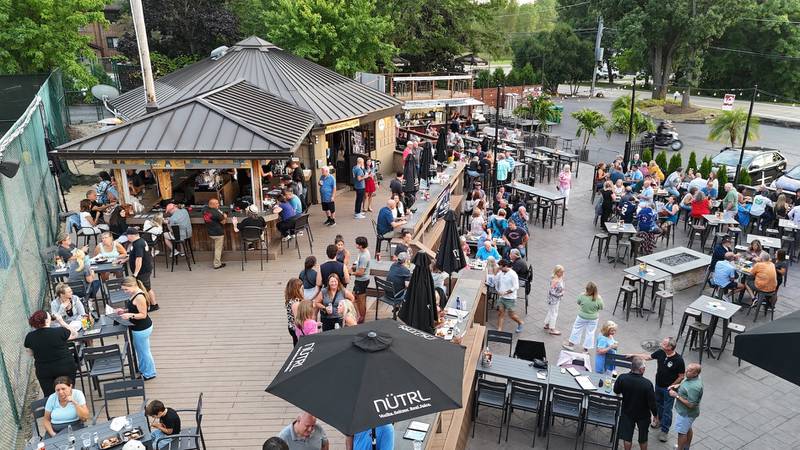 The 3D Sideouts Sports Tavern patio is popular in summer as well as on pleasant fall days. Owner Jerry DeLaurentis says a 16-foot LED screen and numerous other ultra-vibrant outdoor TVs make it a tailgate-like draw for NFL fans.