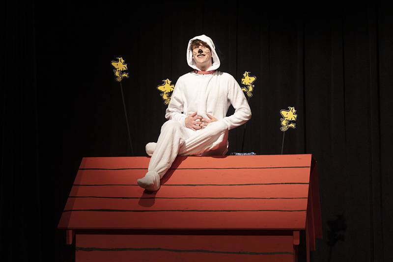 Snoopy, played by Nathaniel Burger, rehearses with some feathered friends Tuesday, March 7, 2023 for Newman High’s “You’re a Good Man Charlie Brown.” Performances will be March 9, 10 and 11 at 7 pm and March 12 at 2 pm at the Jerry Mathis Theatre at Sauk Valley College.