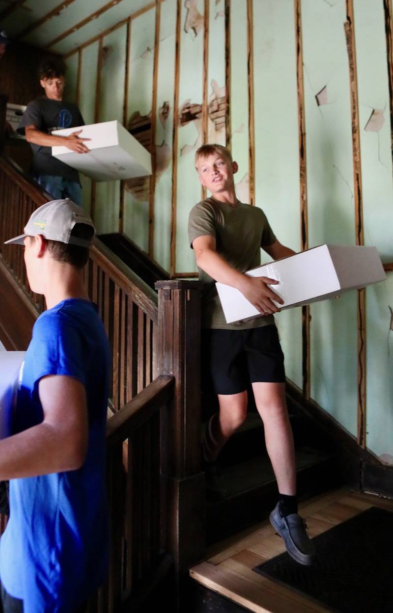 PHS sophomore Noah Morton helped move boxes from the third floor of the Sash Stalter Matson Building to the basement in a matter of 15 minutes for the Bureau County Historical Society.