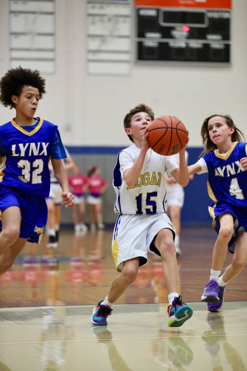 Logan seventh-grader Jonah Taylor takes in a layup against LaSalle Lincoln on Fight like Erin Night Tuesday at Prouty Gym.