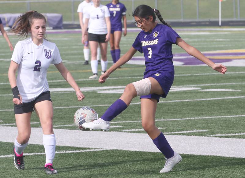 Mendota's Karen Flores saves the ball from going out of bounce as Dixon's Meredith Foulker defends on Wednesday, May 1, 2024 at Mendota High School.