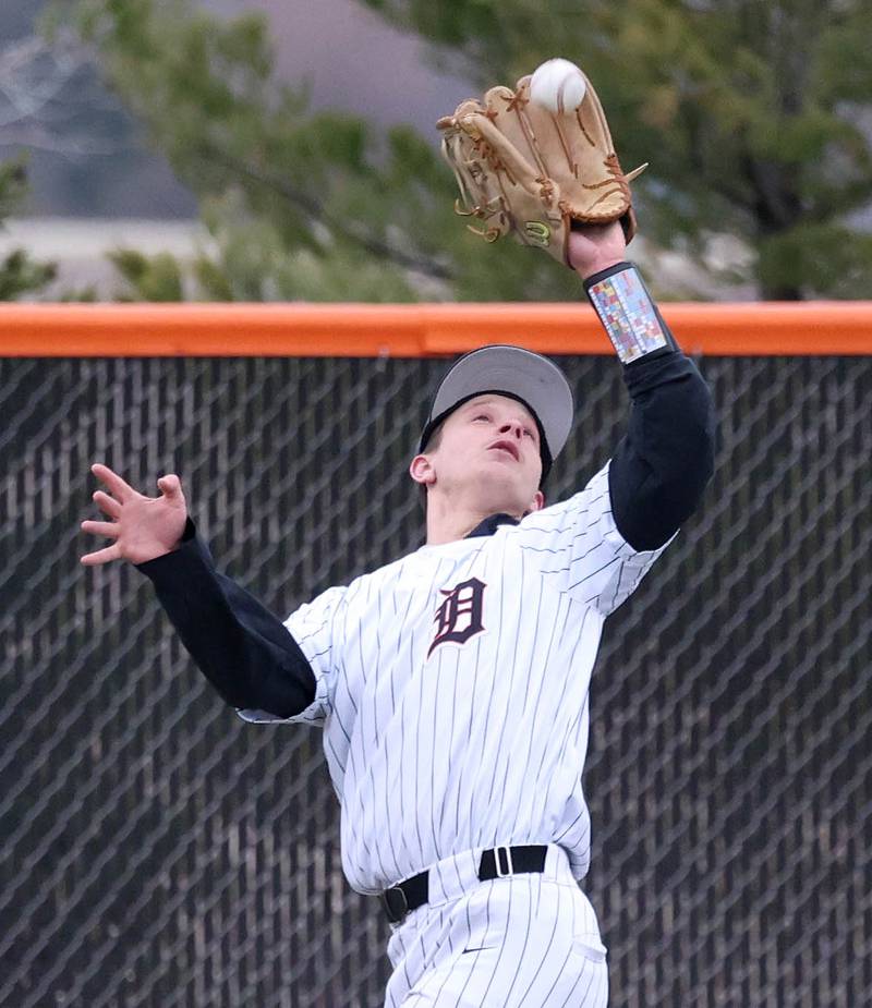 DeKalb's Ruari Bengford-Breneisen catches a fly ball in left field during their game against Harlem Tuesday, April 1, 2025, at DeKalb High School.