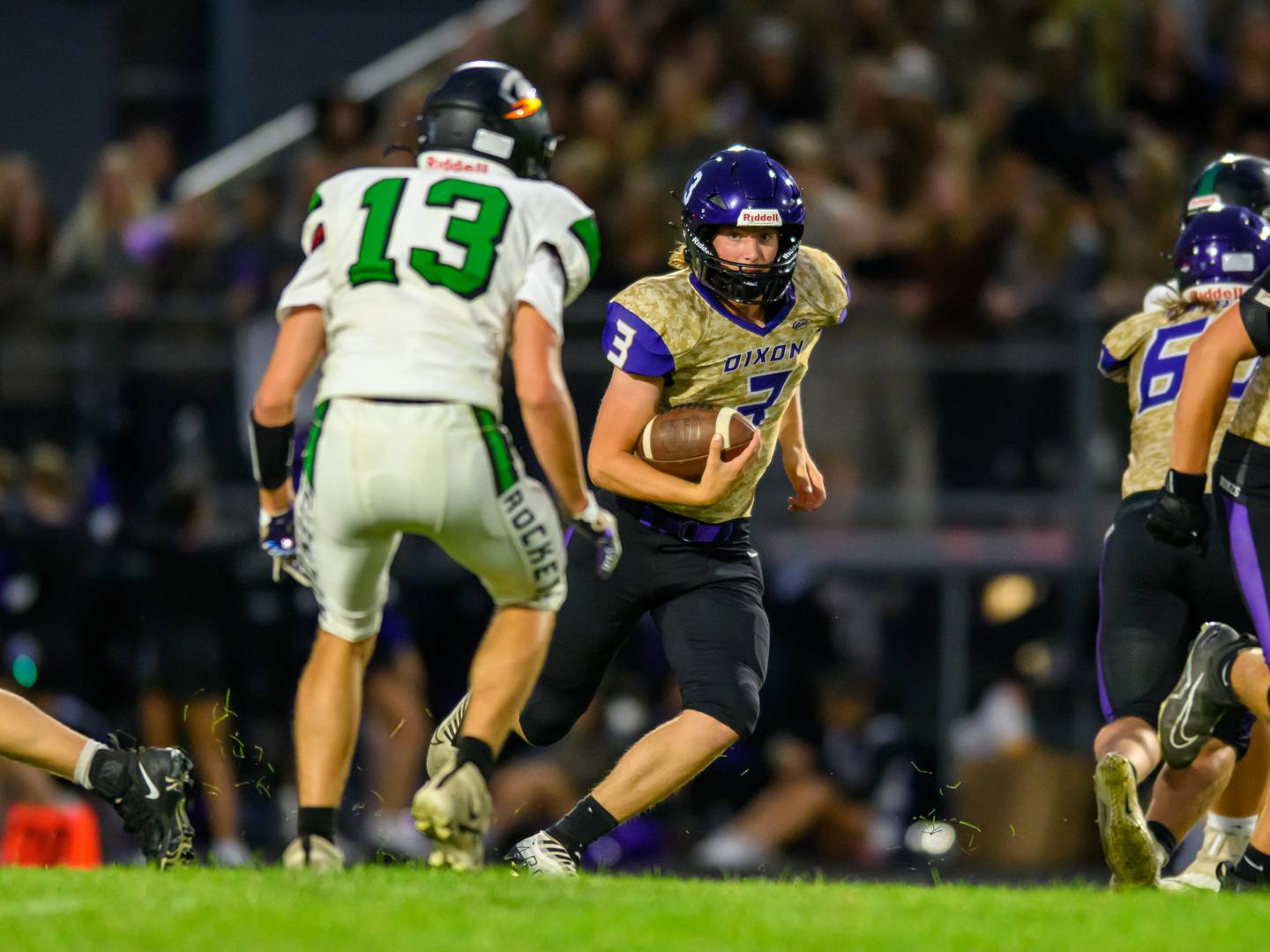 Dixon's Tyler Shaner finding an open hole in Rock Falls defense in Rock Falls on Friday, Sept. 8, 2023.