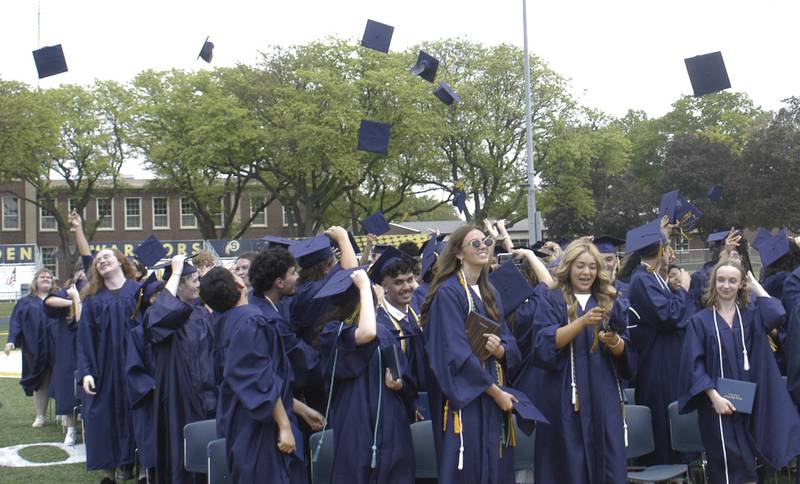 Caps fly as the SHS Class of 2026 ends its commencement ceremony Sunday, May 17, 2026, at Roscoe Eades Field in Sterling.