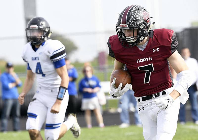 Plainfield North's TJ Kane runs the ball during the game against Highland Park on Saturday at Plainfield North High School in Plainfield. Plainfield won, 42-0.